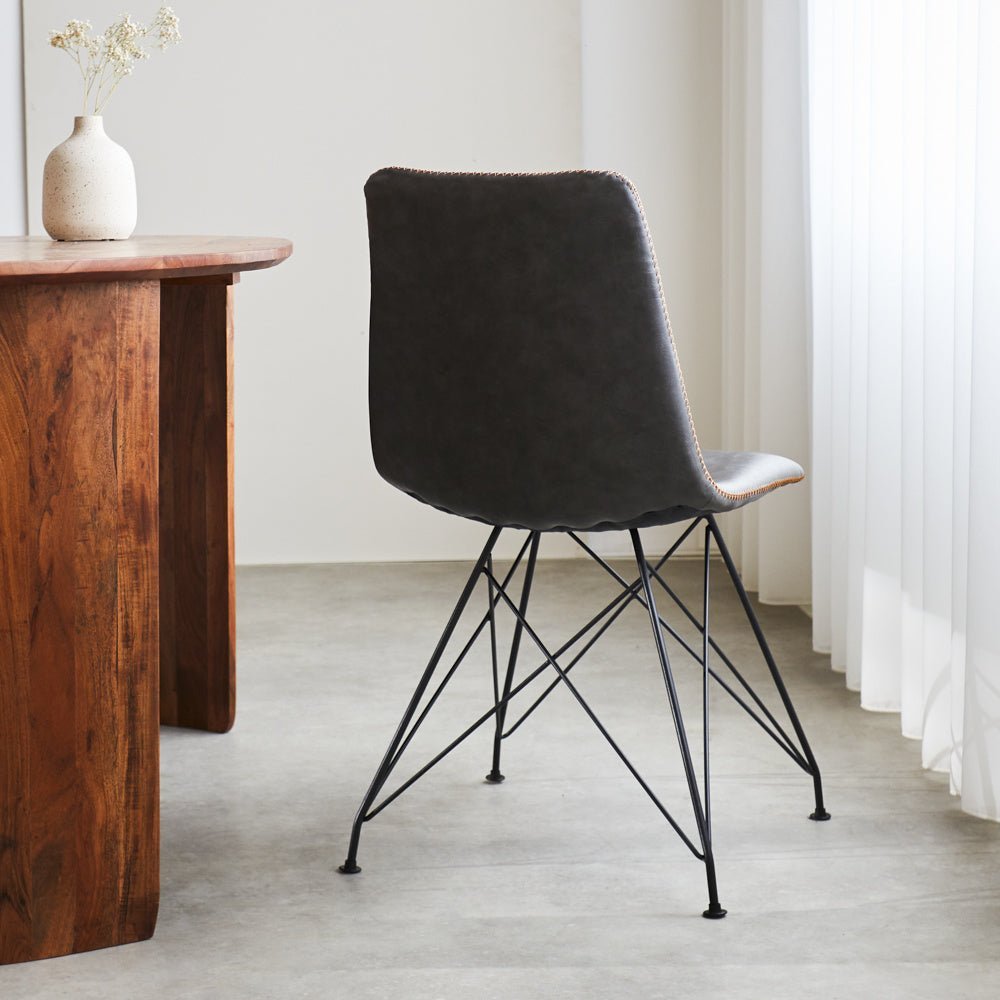 Dining room chair Viano Dimehouse Anthracite LxWxH 64x61x52 Faux leather Atmospheric photo diagonal rear view