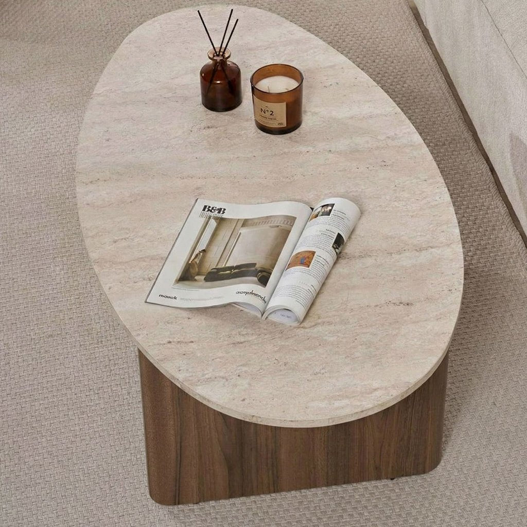 Organic pebble-shaped coffee table with a travertine-look top and walnut melamine base. Japandi design of 120x60cm.