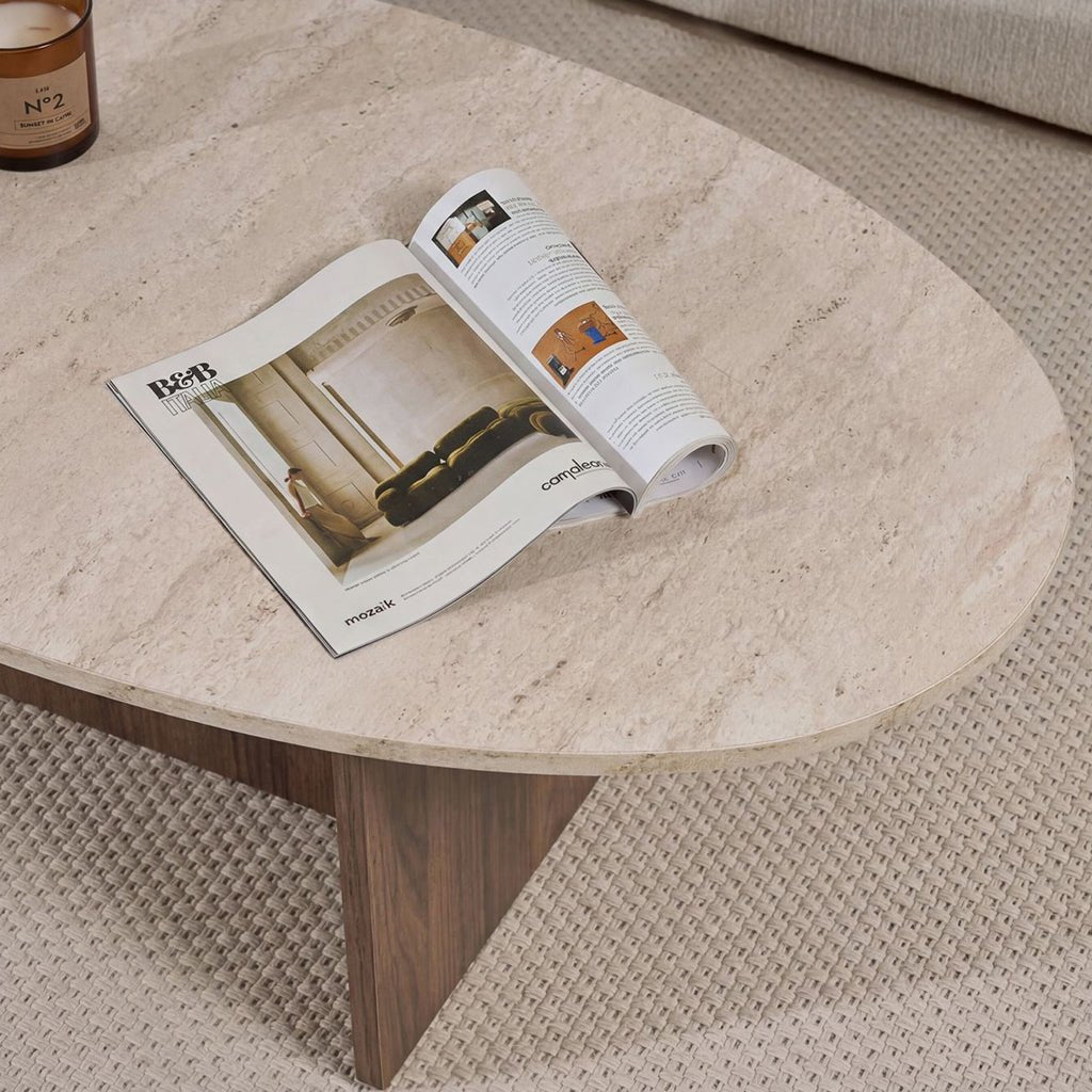 Organic pebble-shaped coffee table with a travertine-look top and walnut melamine base. Japandi design of 120x60cm.
